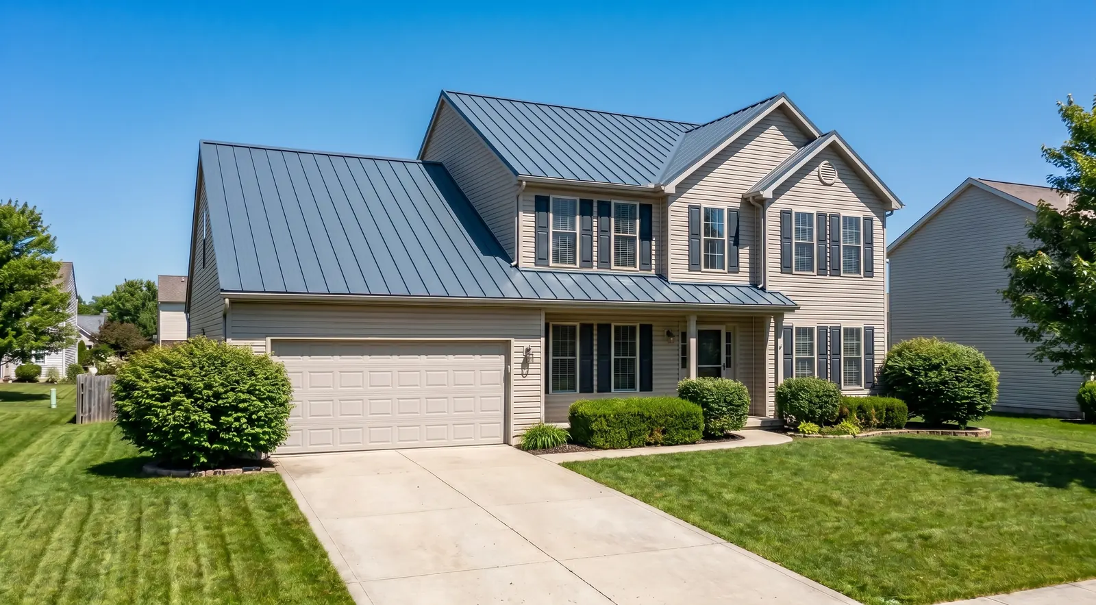 After, new slate-blue standing seam metal roof