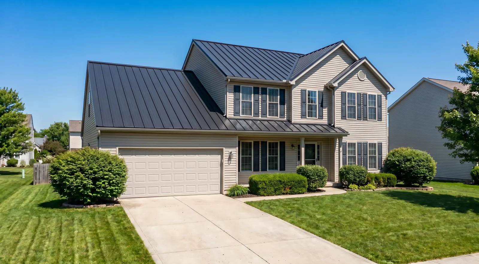 After, new charcoal standing seam metal roof